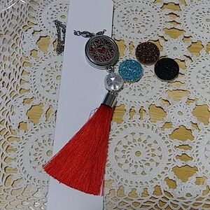 Aromatherapy pendant with chain and pads for essential oils